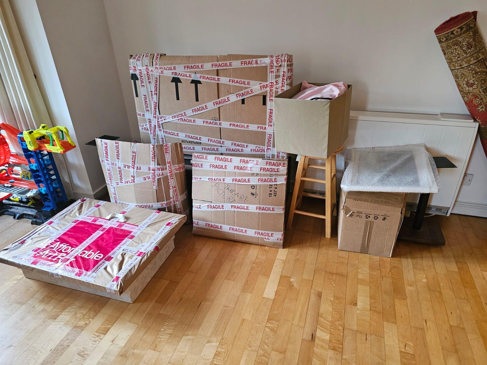 A room packed down — cartons taped, bundled and ready