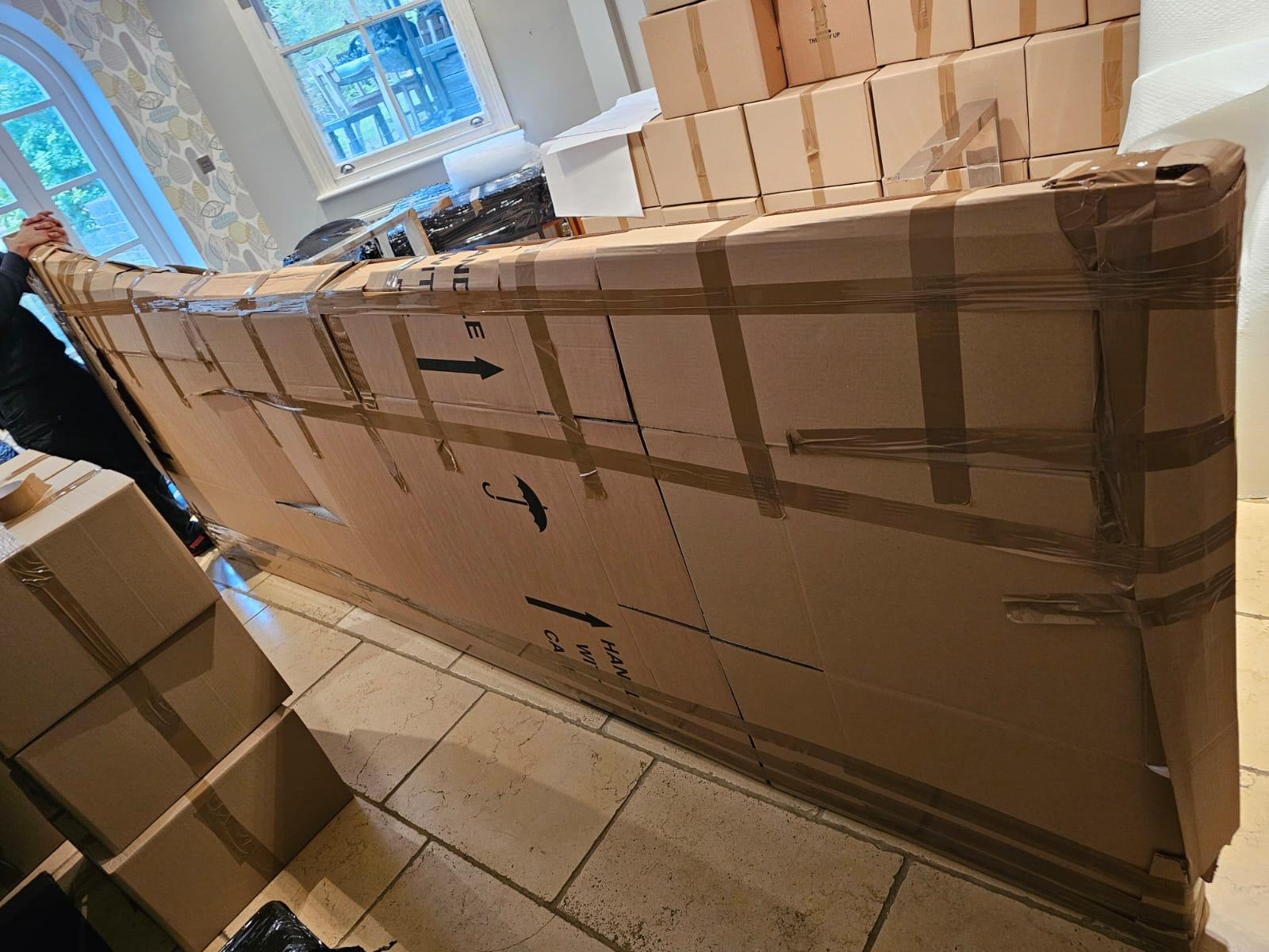 An oversized piece boxed and protected before the move